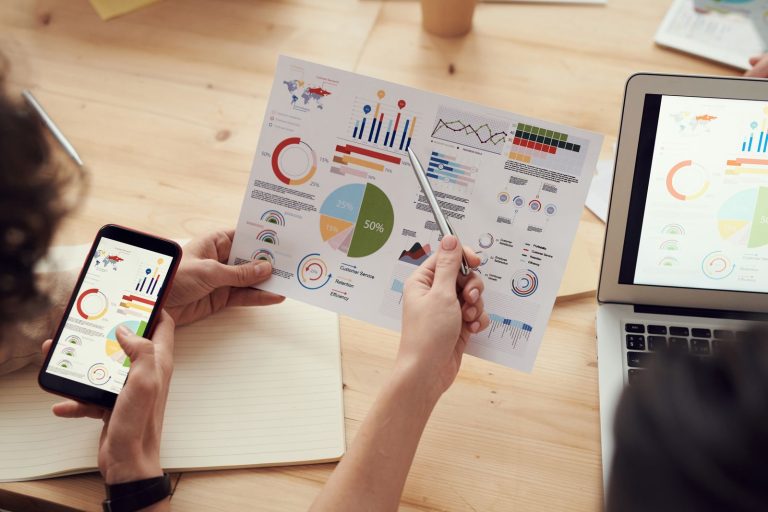 Agencies That Have Worked Your Vertical Outperform Those Learning It Now Agencies That Have Worked Your Vertical Outperform Those Learning It Now: marketing specialists reviewing SEO and campaign analytics charts at a desk